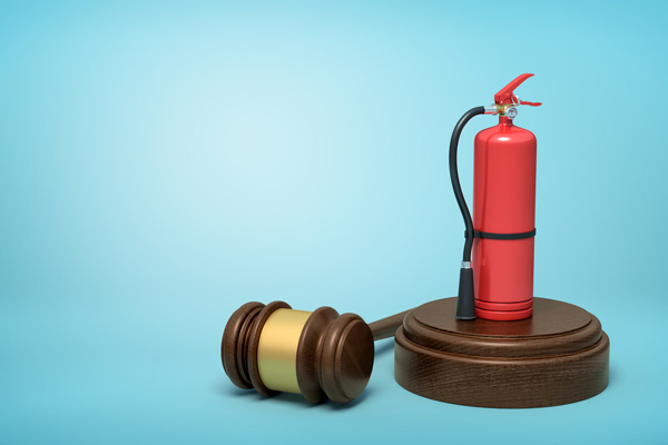 firefighting-course-3d-rendering-of-red-fire-extinguisher-standing-on-sounding-block-with-gavel-lying-beside-on-light-blue-background-with-145491397