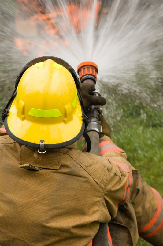 firefighting-course-firefighter-putting-out-fire