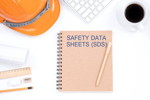 health-and-safety-training-concept-safety-data-sheets-sds-top-viwe-of-modern-workplace-w-124149266-min